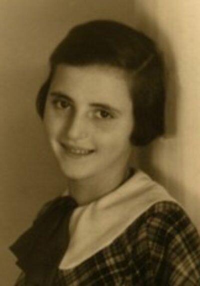 Lore May Rasmussen wearing plaid dress smiling