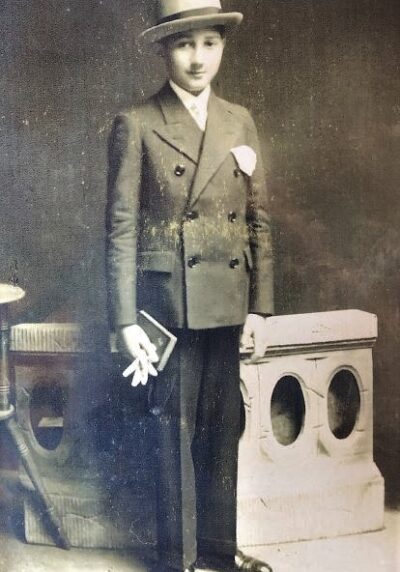 Bar mitzvah picture of boy wearing coat