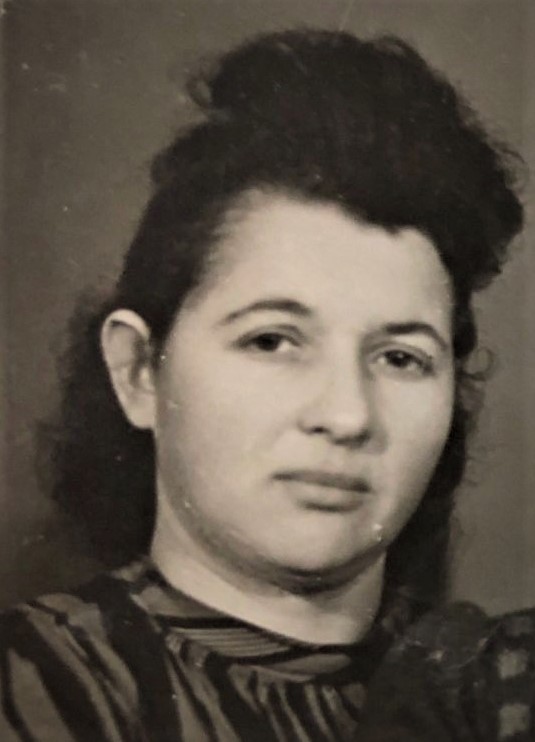 woman smiling for photo with hair pinned up