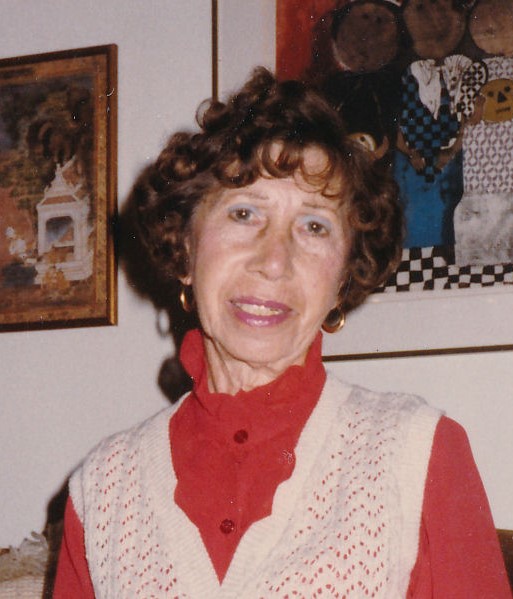 Old woman wearing sweater vest and red shirt