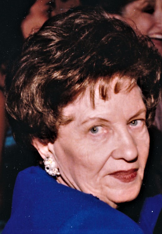 Older woman wearing blue and lipstick