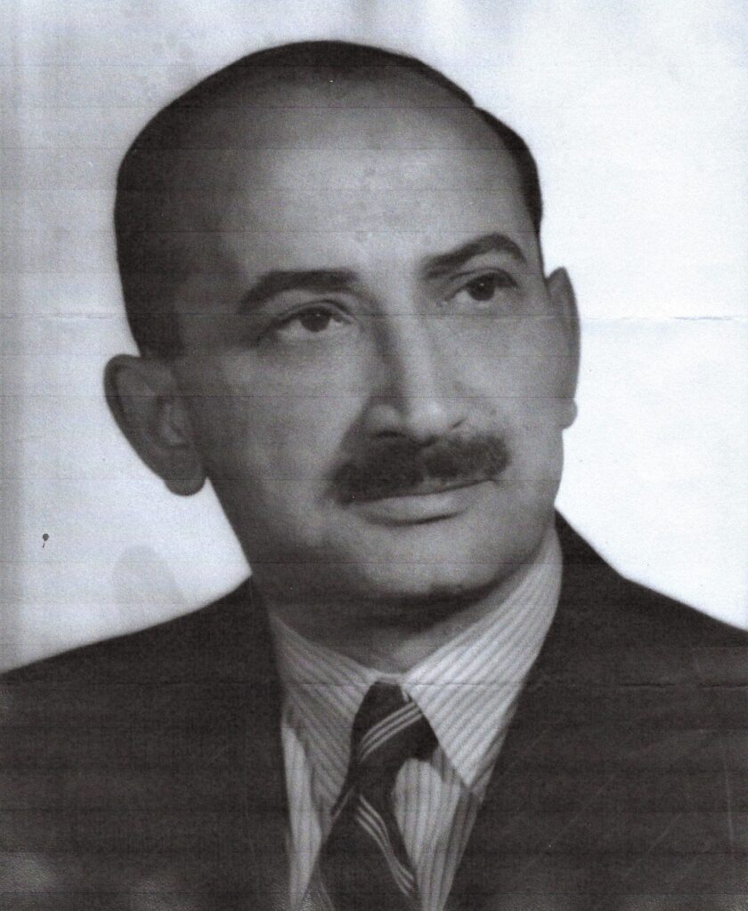 Leo - man with thicker mustache wearing stripped shirt