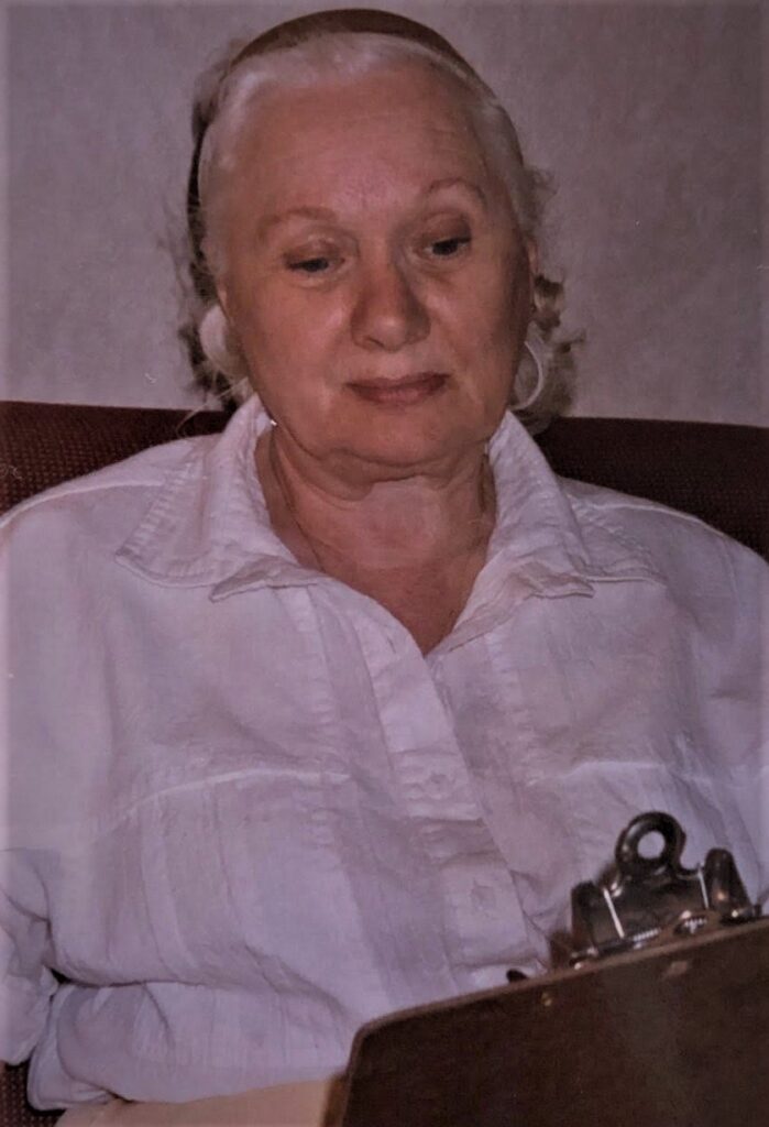 Pauline Davidson looking at clipboard