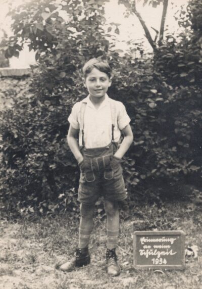 Robert May outside wearing suspenders