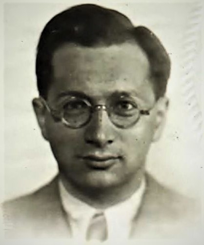 Viktor Spira headshot - man wearing glasses and coat