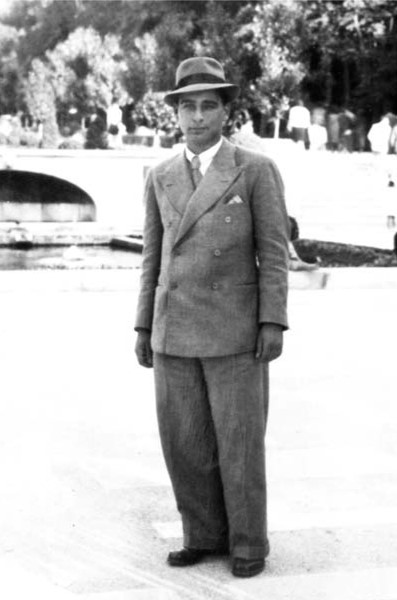 Man wearing suit standing outside
