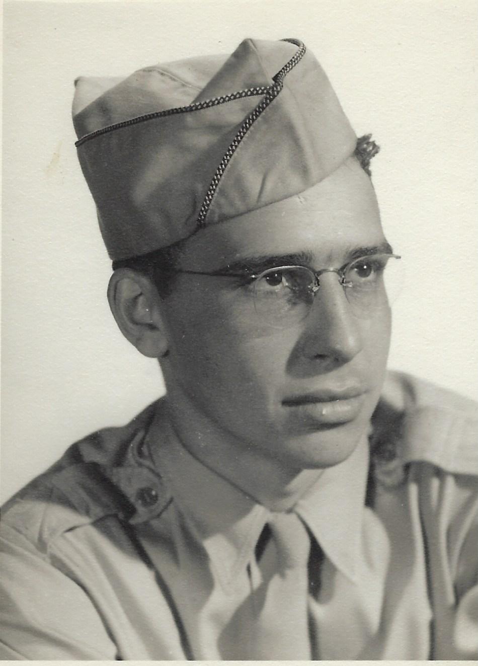 Man wearing military uniform wearing glasses and hat
